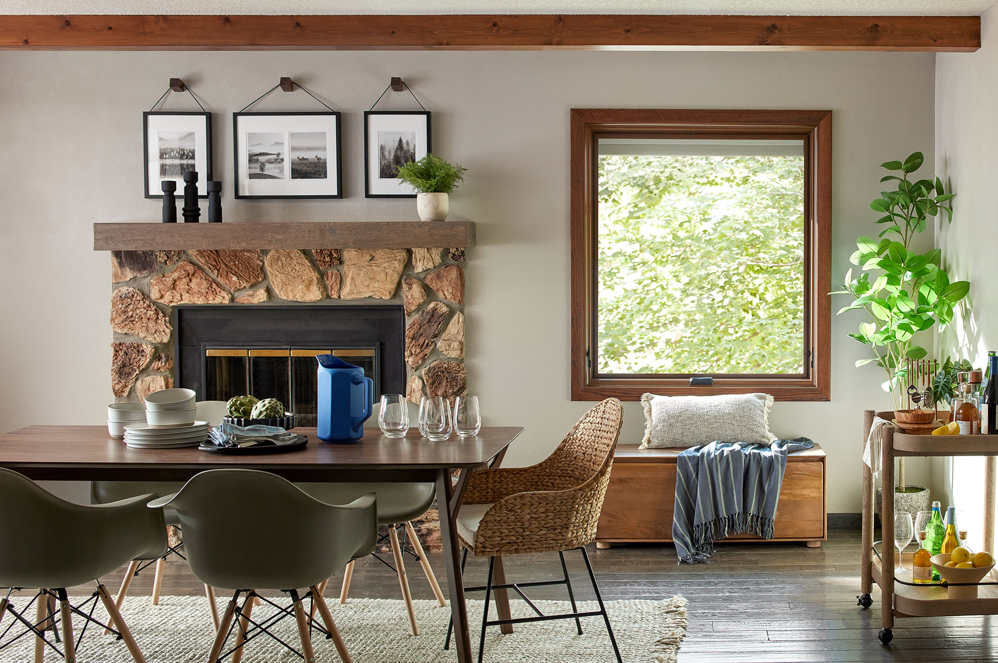 Wood-framed awning window in cozy dining room