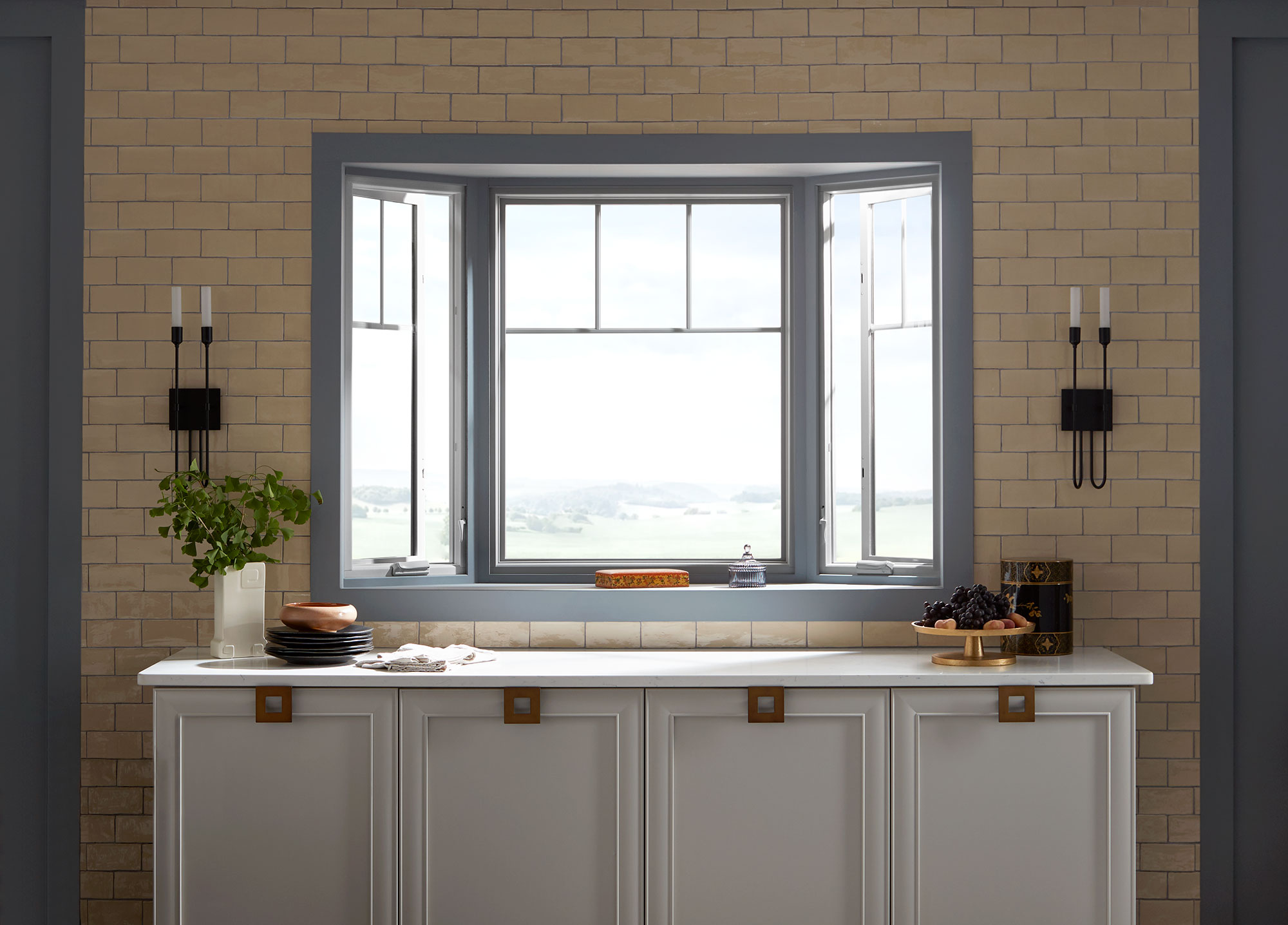 Bay window above kitchen counter with countryside view