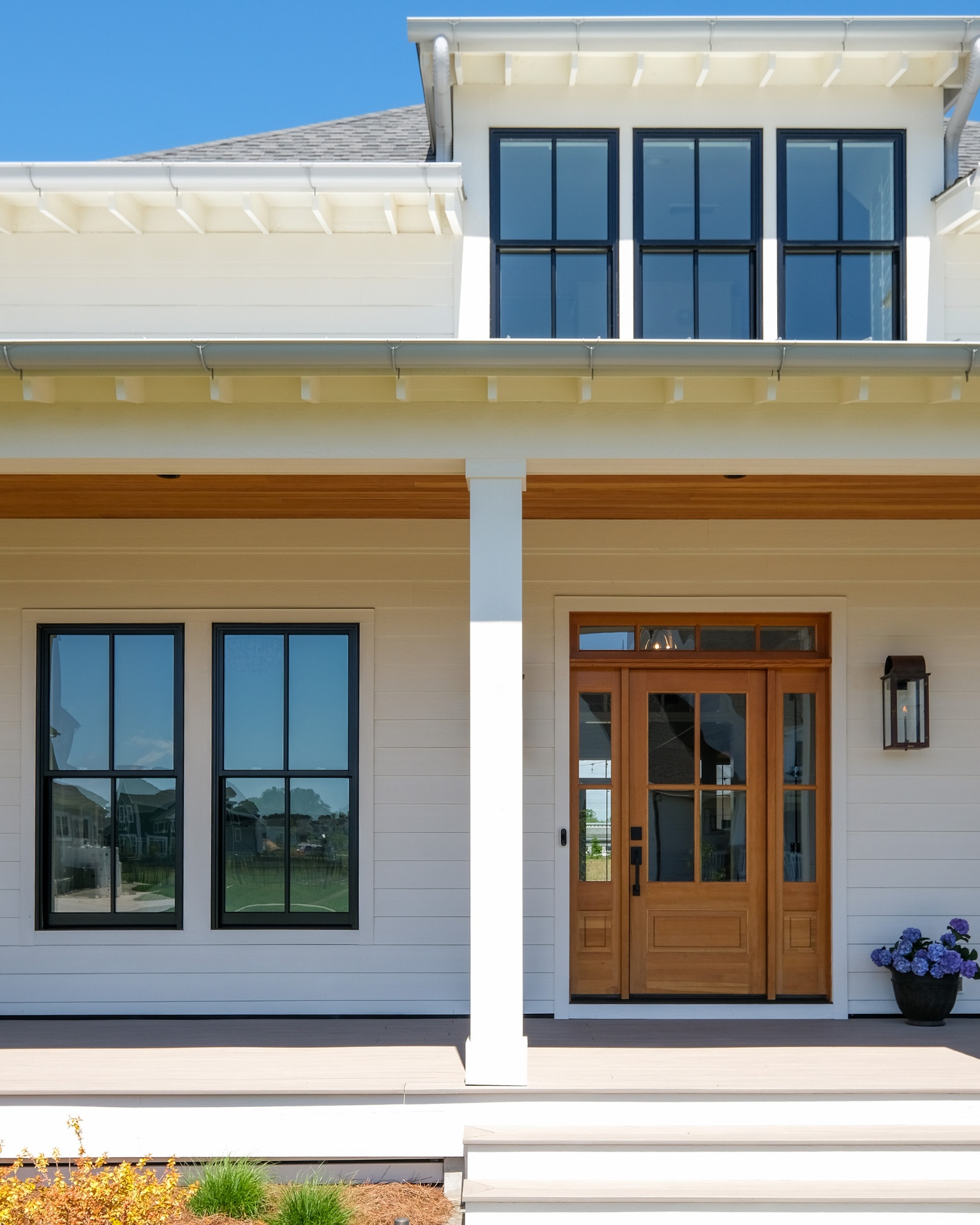 Double-hung windows on modern farmhouse
